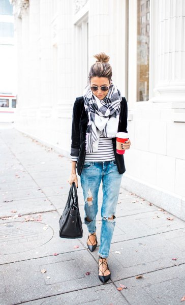 black blazer with striped t-shirt and badly ripped boyfriend jeans