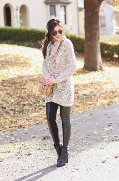 gray ribbed long sweater with faux neckline and black leather leggings