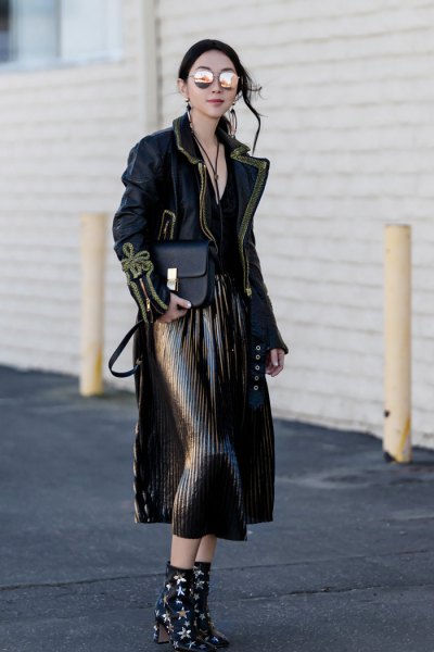 black maxi jacket with pleated midi skirt and star studded heeled ankle boots