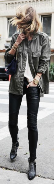 gray military jacket with black leather leggings and studded boots