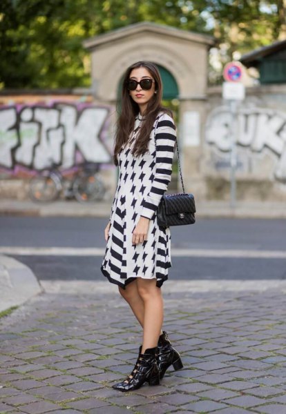 black and white striped mini dress with leather pointed toe boots