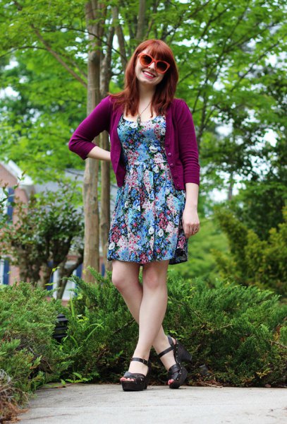 Purple cardigan with three quarter sleeves and a floral mini dress