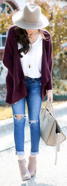 purple chunky zip-up cardigan and ripped skinny jeans