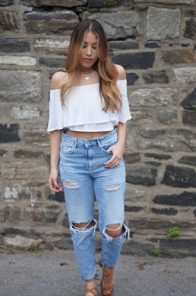 white cropped shoulder blouse with ripped knee jeans