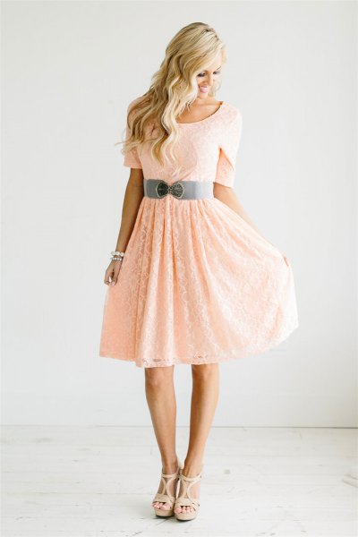 Peach short sleeve fit with belt and flared knee length dress
