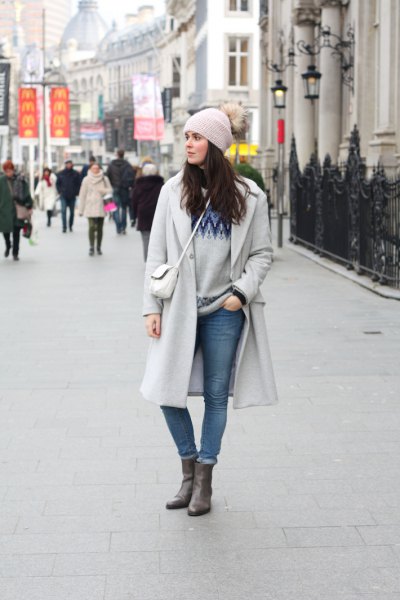 gray knit hat and matching long winter coat and waistband jeans