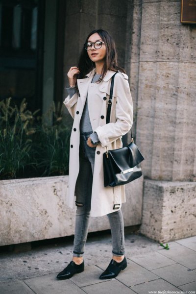 white midi winter trench coat with gray high waisted slim fit jeans with cuffs
