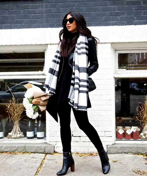 Black and white scarf with mock neck sweater and leather jacket