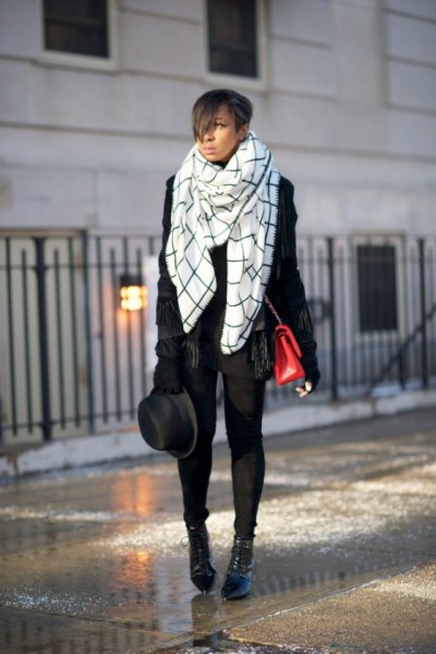 white and black checked blanket scarf with leather jacket