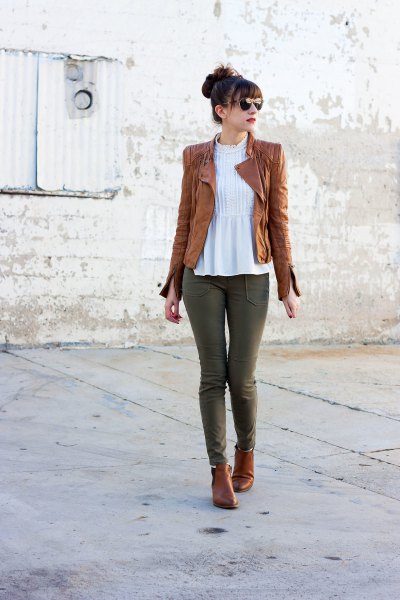 Tank leather jacket with white peplum and gray jeans