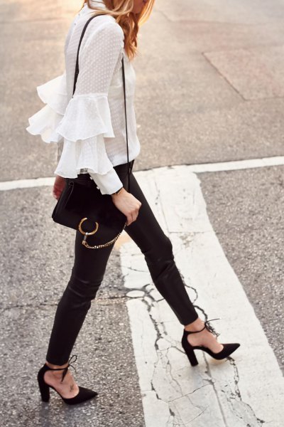 Ruffled white blouse and black leather pants