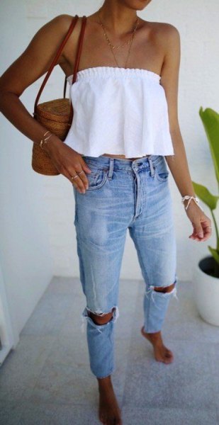 white strapless crop top with ripped jeans