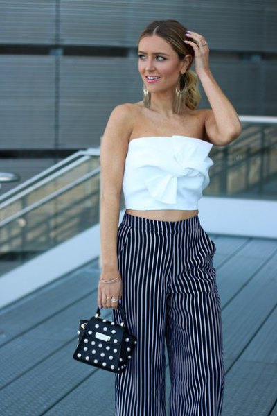 White front-pipe top and striped wide-leg pants