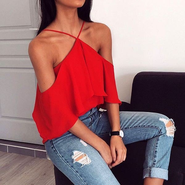 red strapless halter top with ripped skinny jeans
