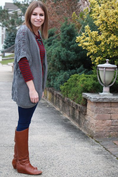 gray cardigan with wide sleeves and brown leather knee-high boots