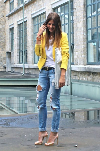yellow blazer with blue ripped boyfriend jeans with gold dress shoes