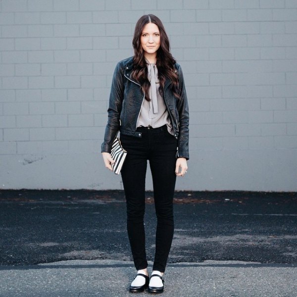 black leather jacket with gray blouse and flats