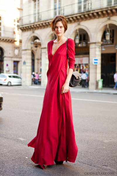 red floor-length wrap dress with three-quarter sleeves and a low cut