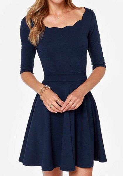 Dark blue skater dress with a scalloped neckline and half sleeves