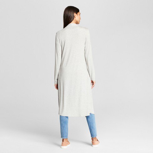white long sweater with midi shawl collar and light blue jeans