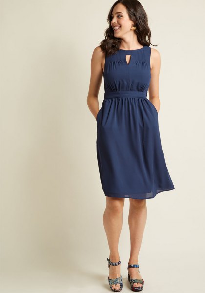The knee length shift dress with a gathered waist in navy