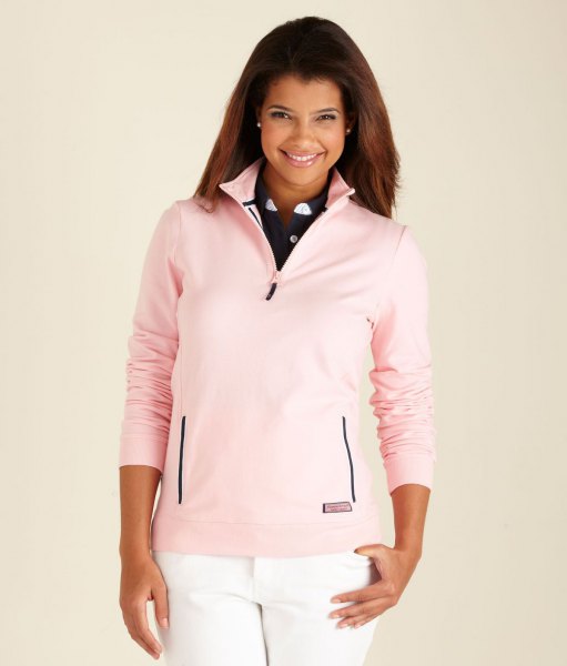 Light pink quarter zip golf jumper and white jeans