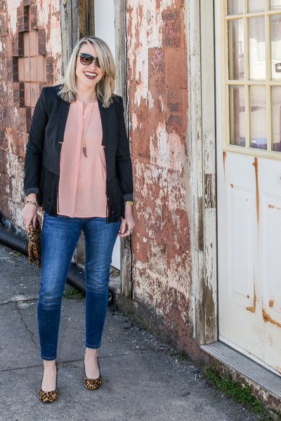 black casual blazer with a blush pink chiffon blouse and blue jeans