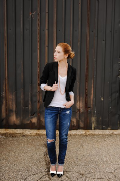 black jacket with half sleeves and white scoop-neck tank top and blue jeans