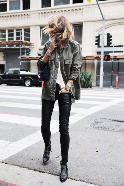 gray denim jacket with black leather leggings and ankle-toed boots
