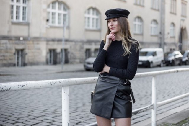 Leather hat with a long sleeve t-shirt and a moto wrap mini skirt