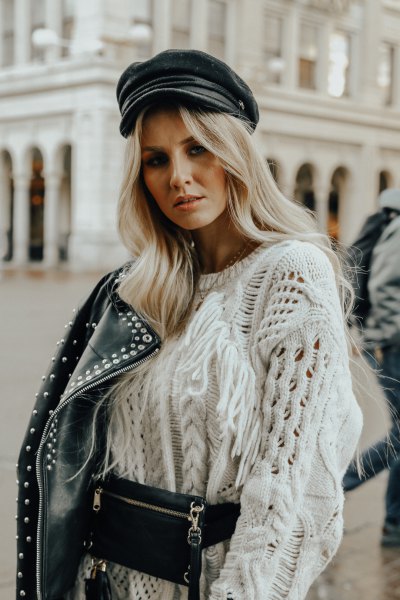 White chunky knit sweater with moto rivet jacket and leather hat