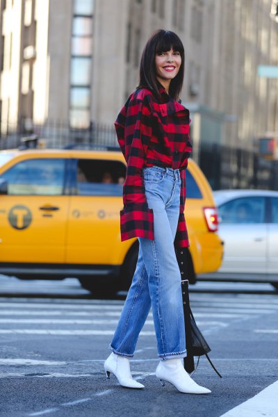 red and black plaid shirt with blue straight jeans and white kitten heel boots