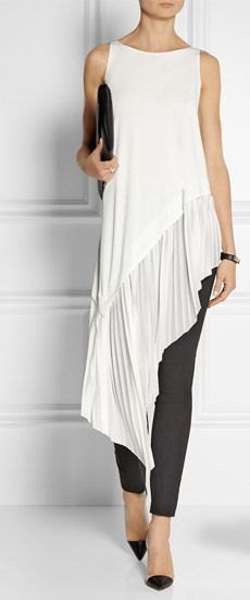 white sleeveless high-low tunic blouse with black skinny jeans