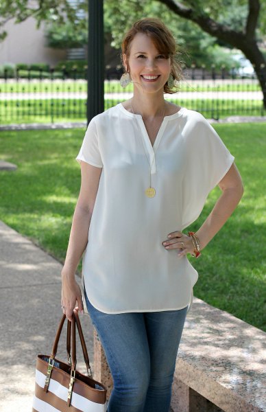 white short-sleeved V-neck blouse and blue jeans