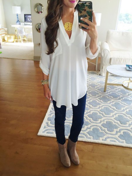 white V-neck top and gray suede boots