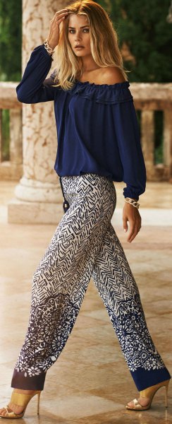 Off shoulder dark blue blouse with relaxed fit printed pants
