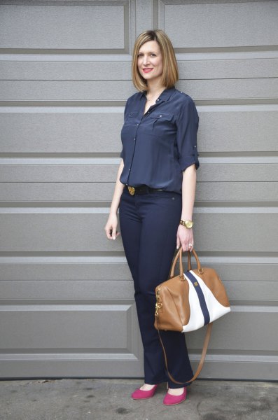 Dark blue button down shirt and slim fit jeans