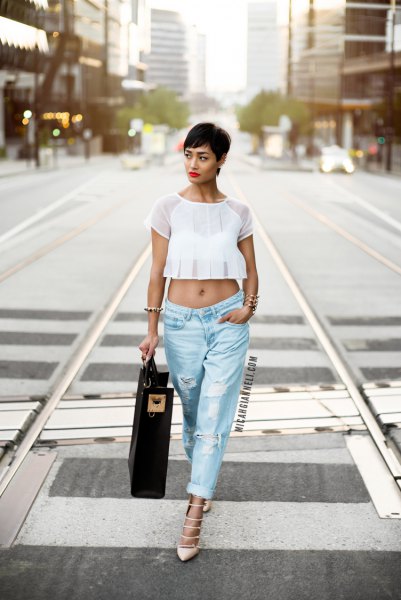 White chiffon crop top with light blue ripped baggy boyfriend jeans