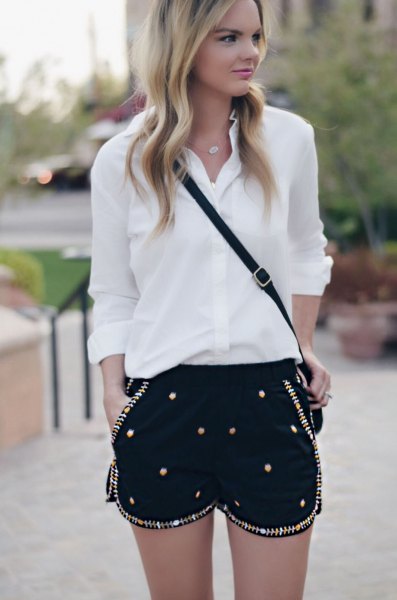 white chiffon shirt with button placket, black shorts embroidered with sequins