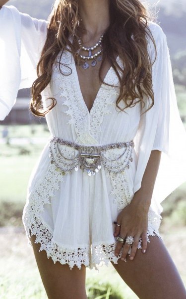Boho style white lace wrap mini dress with silver statement belt