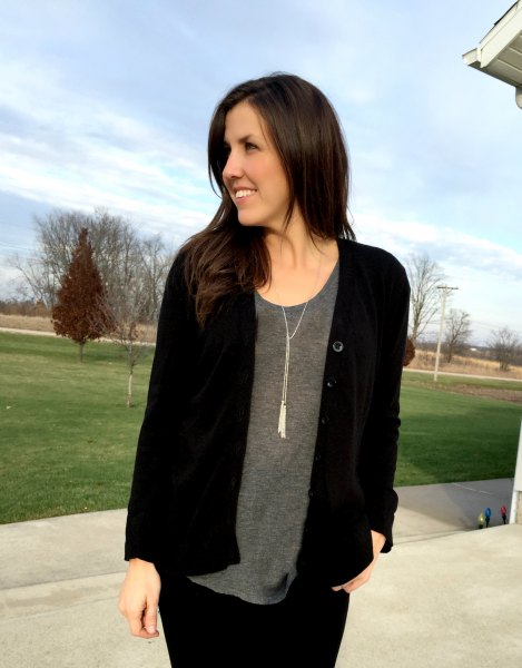 black cardigan with gray scoop neck t-shirt and necklace in boho style