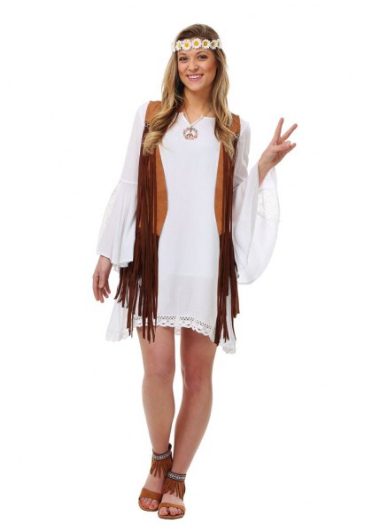 white shift dress with bell sleeves and black hippie waistcoat