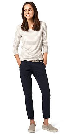 white and light gray striped long sleeve top with slim fit jeans with black cuffs