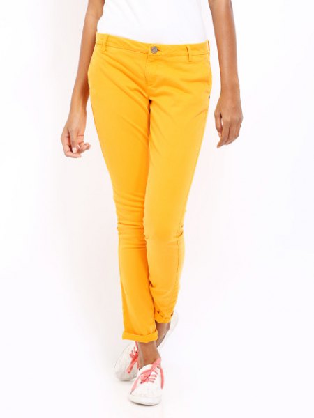 white short-sleeved t-shirt with lemon yellow slim-fit pants