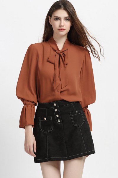Blouse with puff sleeves and green ribbon