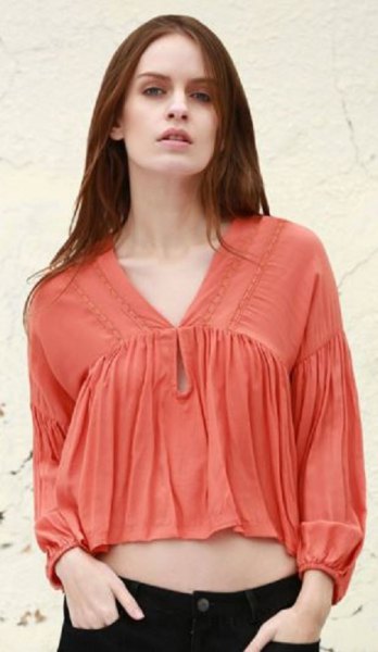 orange short-cut blouse with puff sleeves and V-neckline