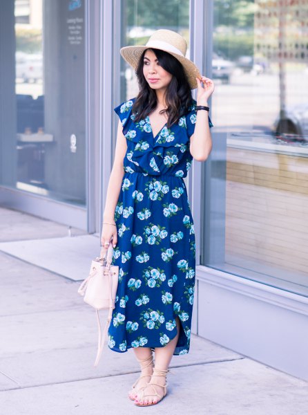 Navy blue v-neck midi dress with floral print and strappy sandals