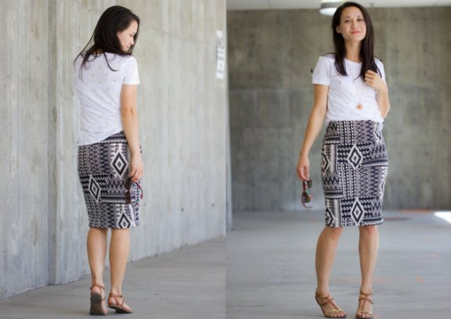 white t-shirt with knee-length knitted skirt with black and white tribal print