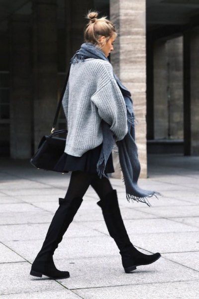 black knee-high boots with wide calves, gray knit sweater