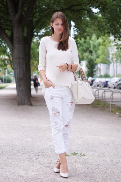 white scoop neck sweater and matching boyfriend jeans with ribbed edges